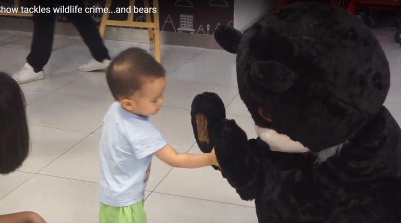 Baby with the Education for Nature - Vietnam bear mascot
